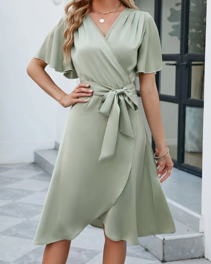 Felicity Statement Short Sleeved Flared Dress with a V Neckline and a Self Tie Belt Boutique Collection