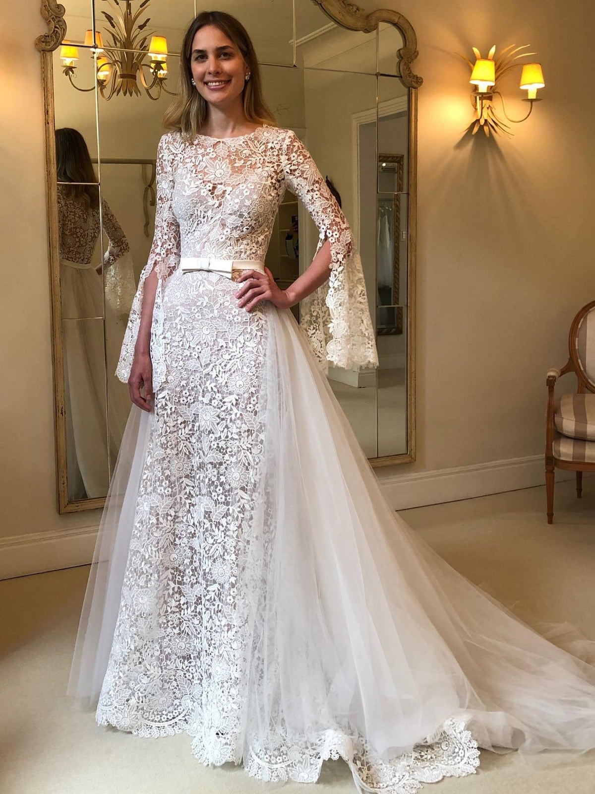 Jewel Neck Bell Long Sleeve Allover Floral Lace A-Line Wedding Dress With Waist Sash - VelvetHem