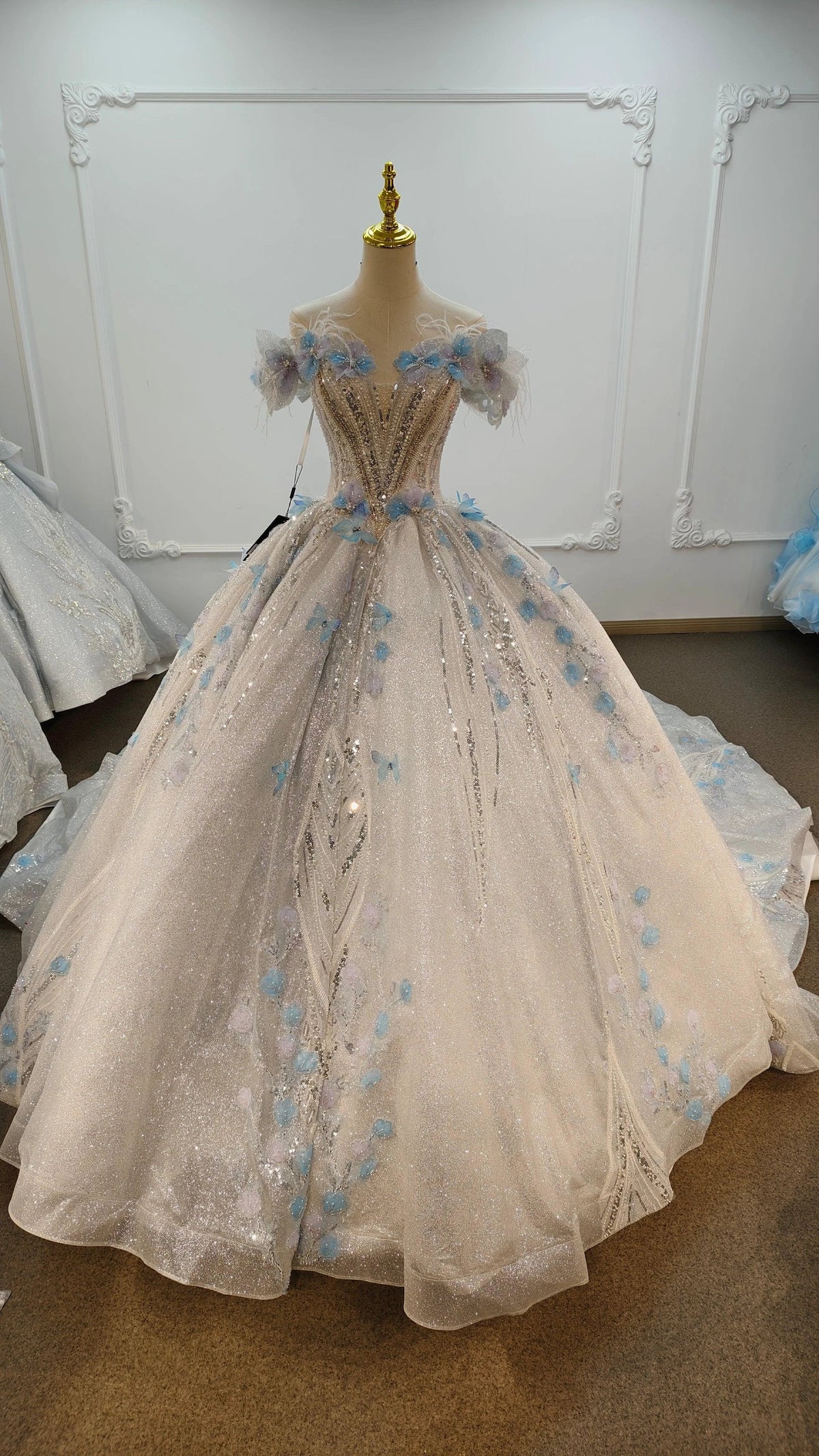 Ethereal Off-the-Shoulder Ball Gown Wedding Dress with Sequin Tulle, 3D Pastel Florals & Feather Accents Ye-2028 (ZD16809) - VelvetHem