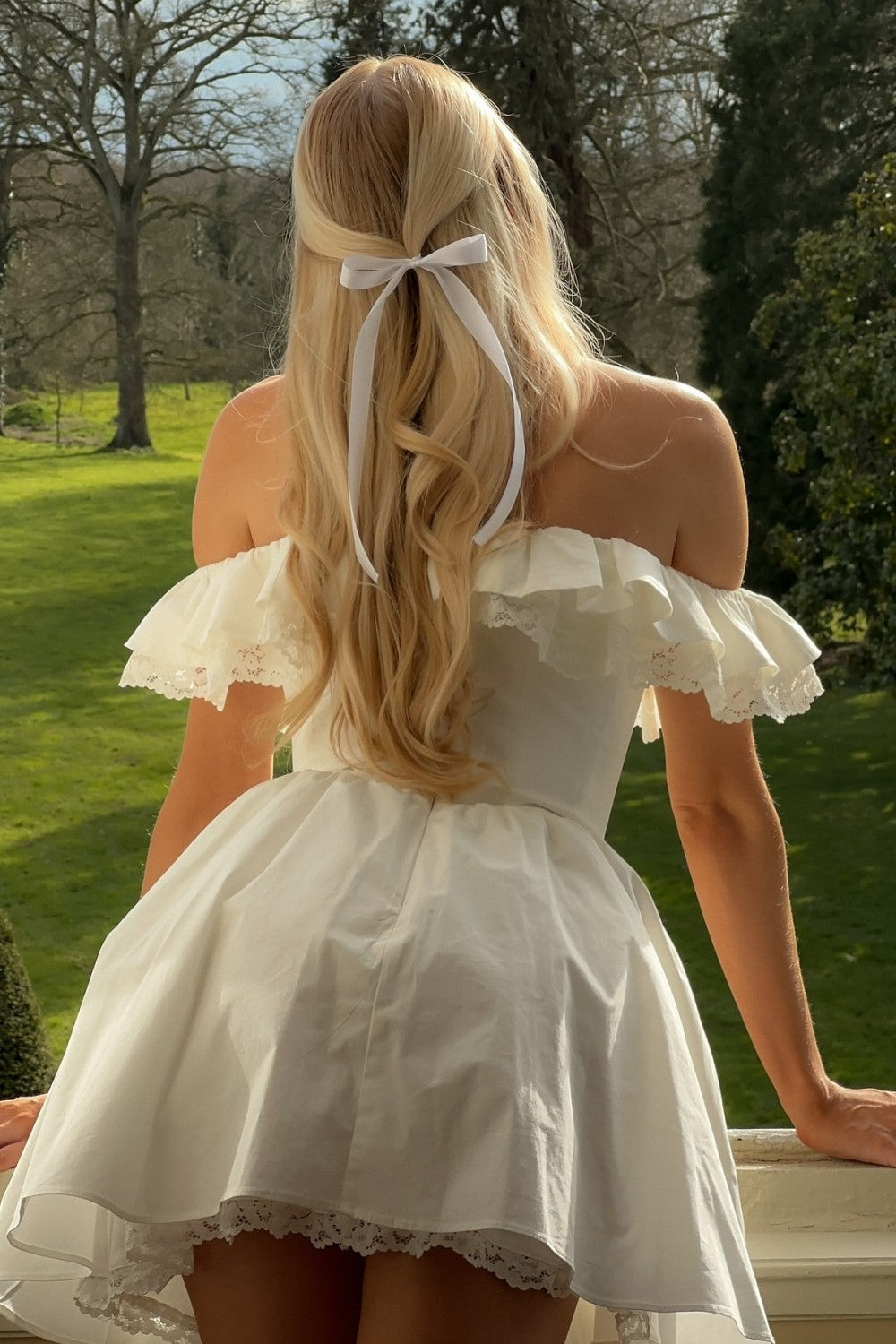 Romantic White Off-the-Shoulder Homecoming Dress with Bow Front and Lace Details