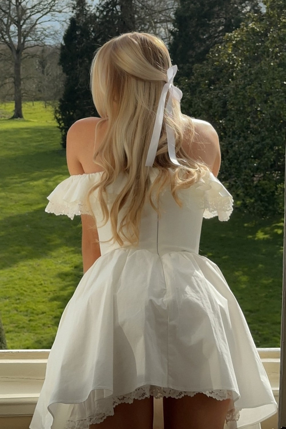 Romantic White Off-the-Shoulder Homecoming Dress with Bow Front and Lace Details