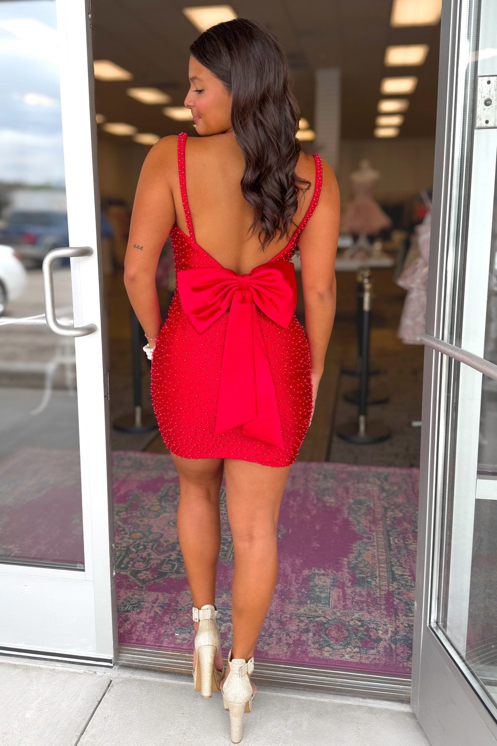 Sparkling Red Beaded Homecoming Dress with Open Back and Bow Detail