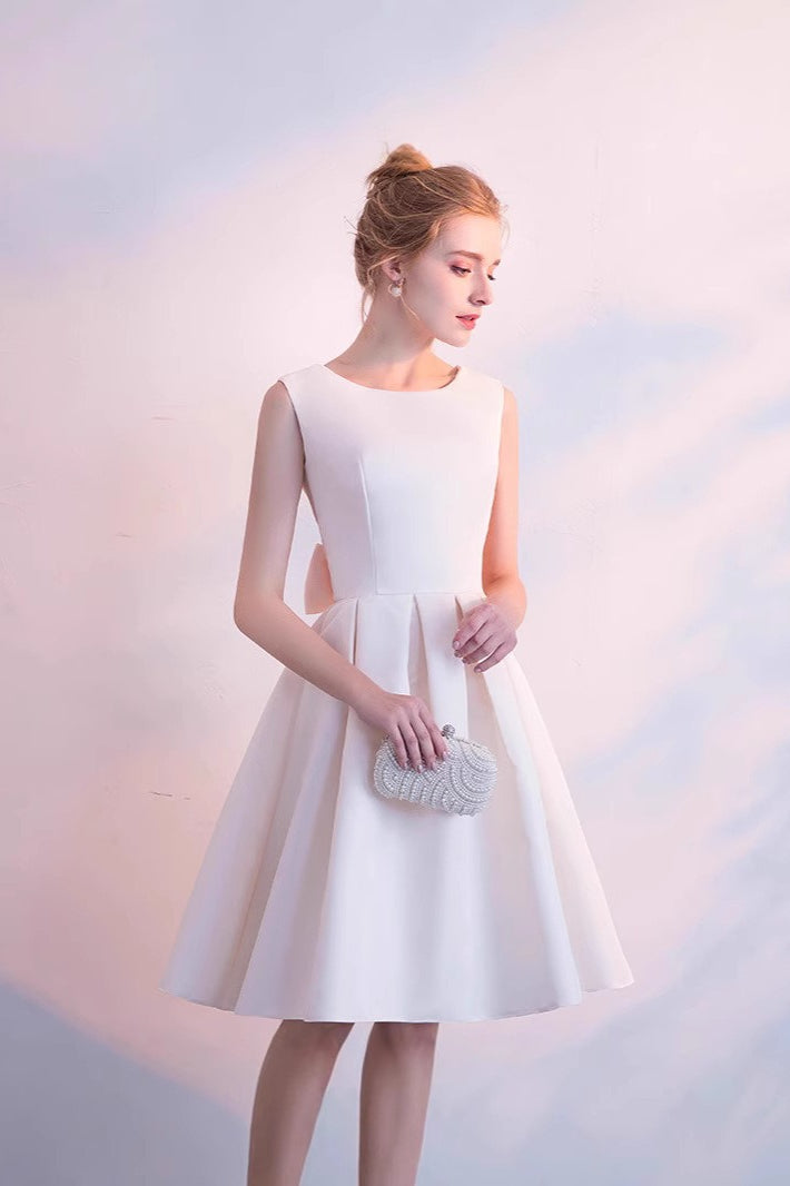 Elegant Bow Mini Dress with Relaxed Fit and Layered Outfit Styling