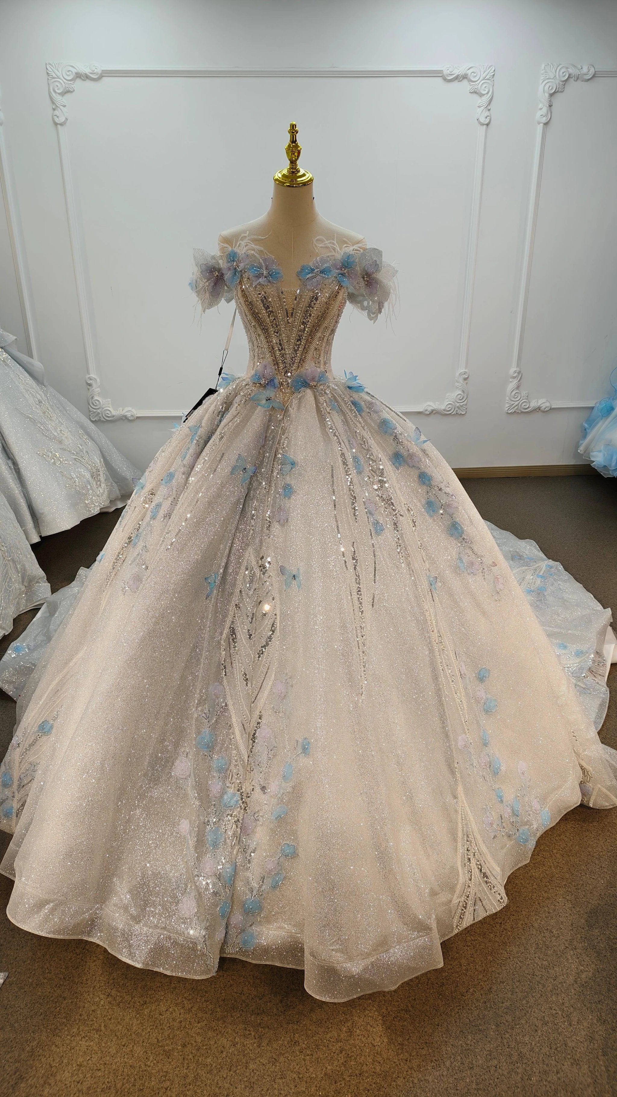 Ethereal Off-the-Shoulder Ball Gown Wedding Dress with Sequin Tulle, 3D Pastel Florals & Feather Accents Ye-2028 by ZAPDRESS