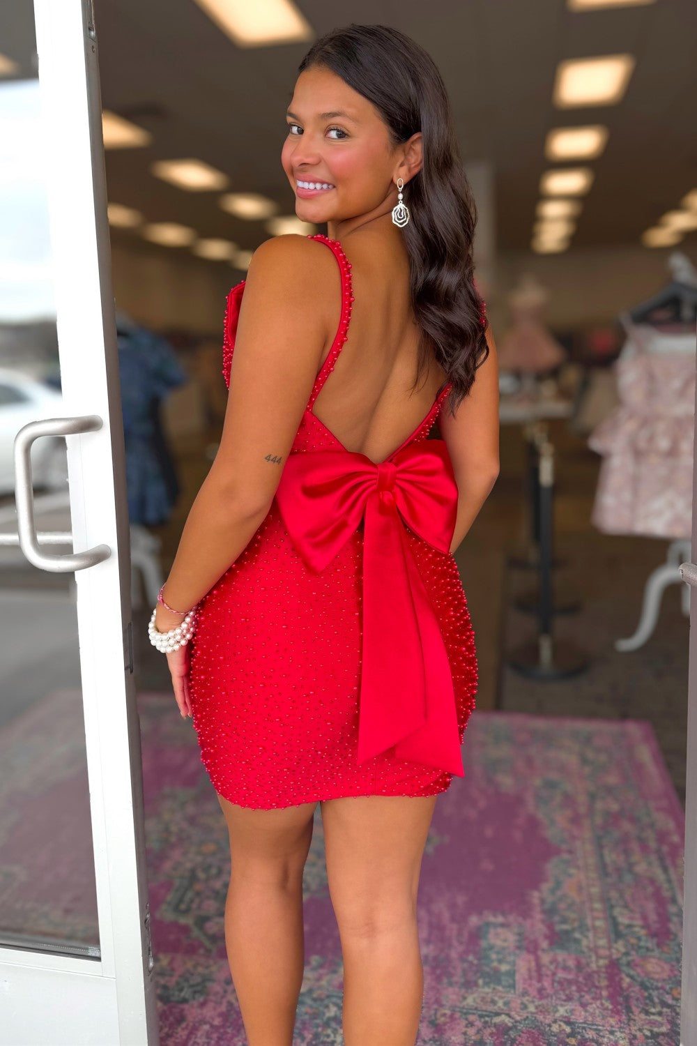Sparkling Red Beaded Homecoming Dress with Open Back and Bow Detail